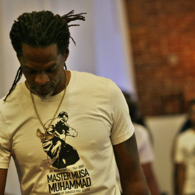 "Master Musa Muhammad - Dr. Moses Powell" - Short Sleeve Unisex T-Shirt
